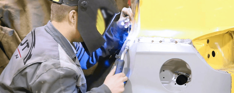 Technician doing Aluminium Car Body Repair