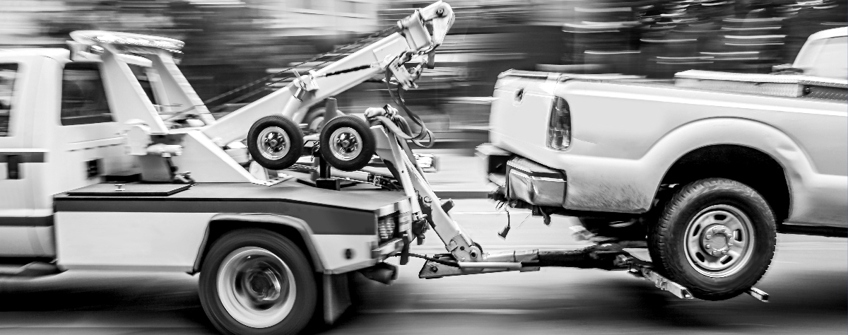 Vehicle being towed by Auto hut Towing truck in Brampton